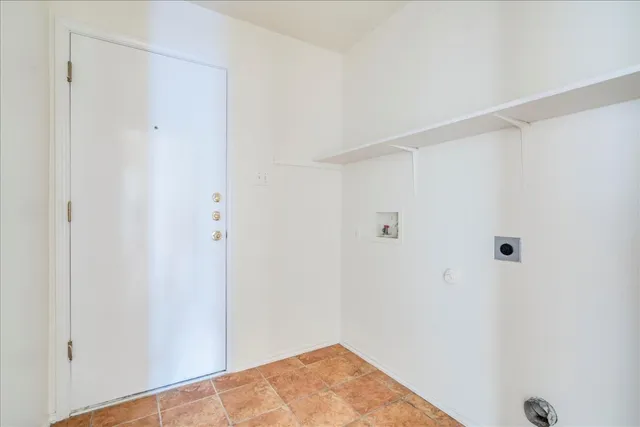 a view of a backyard with wooden fence