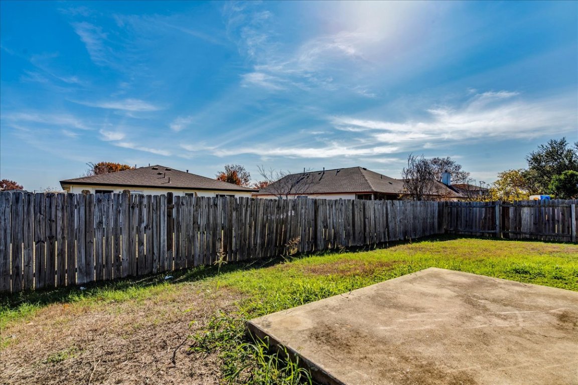 116 Keegans Way Kyle, TX 78640 - Photo 27 of 30 a view of a backyard with wooden fence