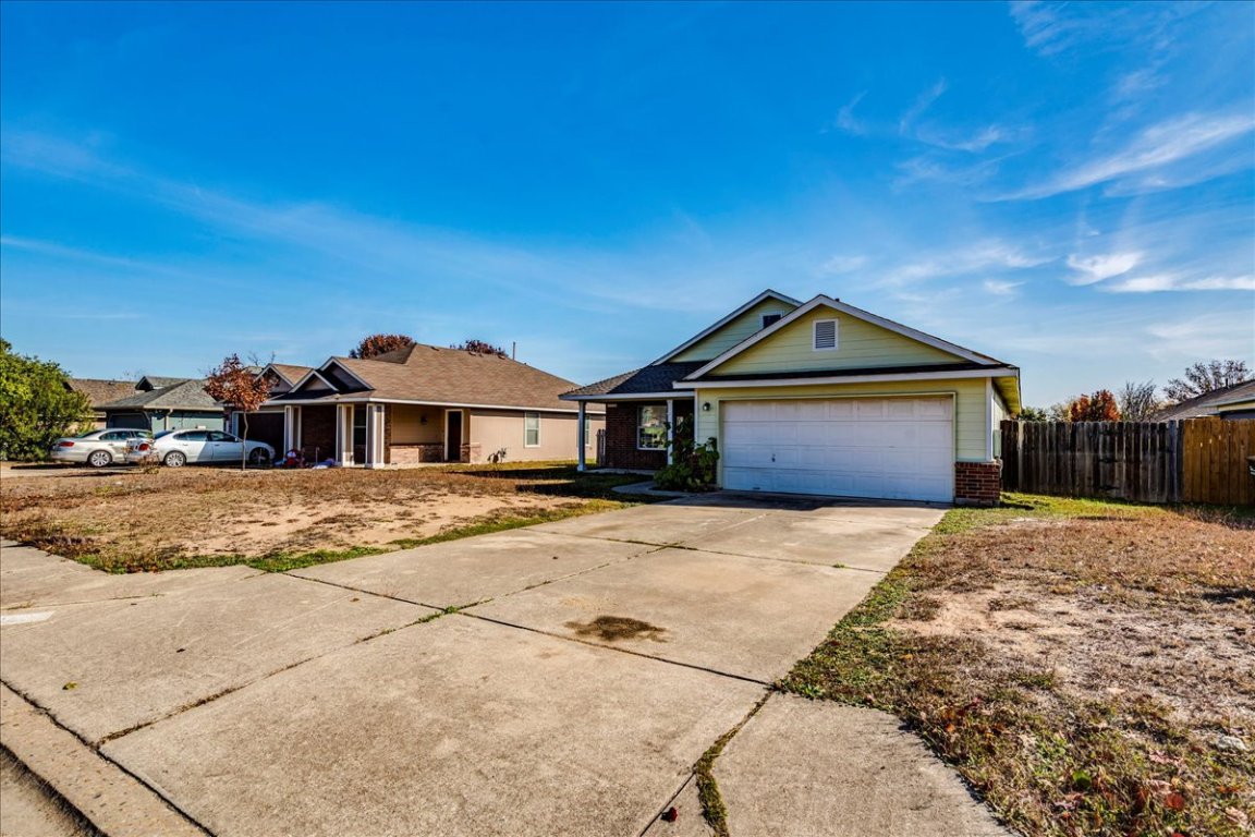 116 Keegans Way Kyle, TX 78640 - Photo 5 of 30 a front view of a house with a yard