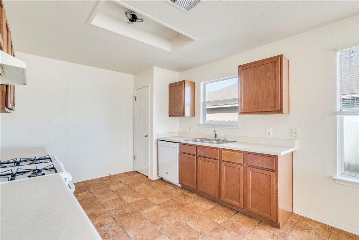 116 Keegans Way Kyle, TX 78640 - Photo 7 of 30 a bathroom with a sink and a mirror