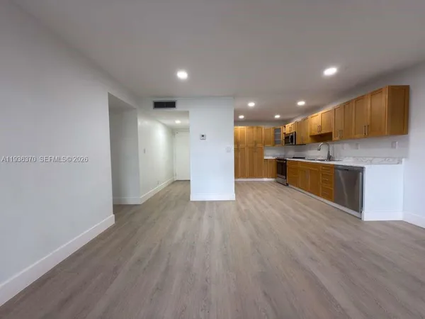 a view of kitchen with wooden floor