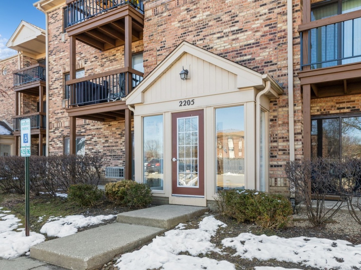 2205 West Nichols Road, Unit F Arlington Heights, IL 60004 - Photo 2 of 15 a front view of a house with a yard