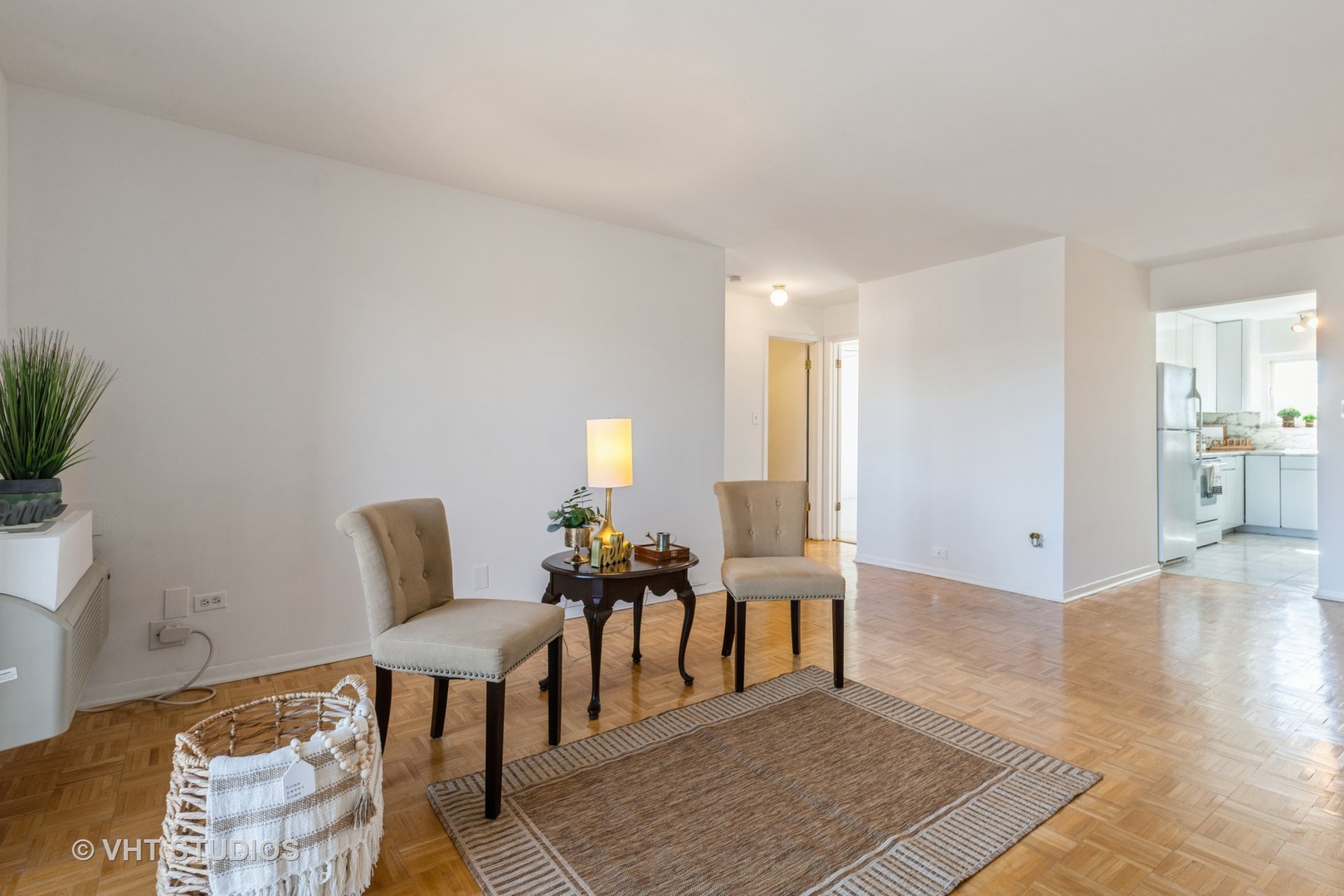 2205 West Nichols Road, Unit F Arlington Heights, IL 60004 - Photo 4 of 15 a view of a livingroom with furniture and wooden floor