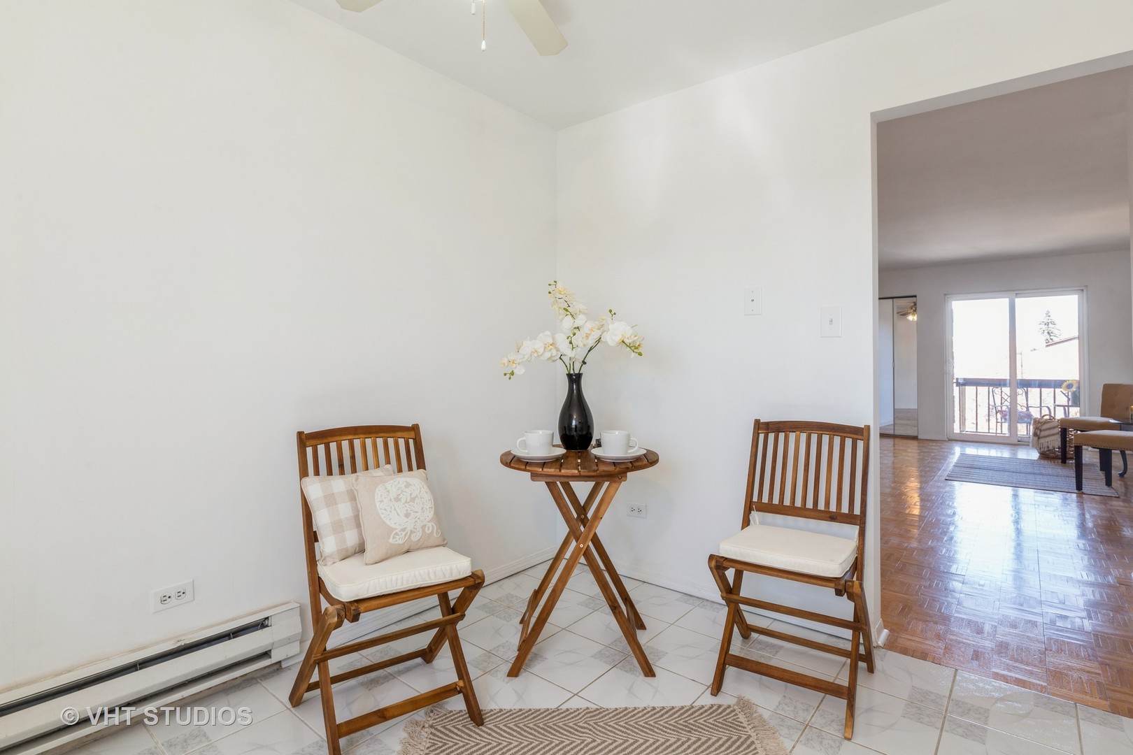 2205 West Nichols Road, Unit F Arlington Heights, IL 60004 - Photo 7 of 15 a view of a livingroom with furniture and wooden floor