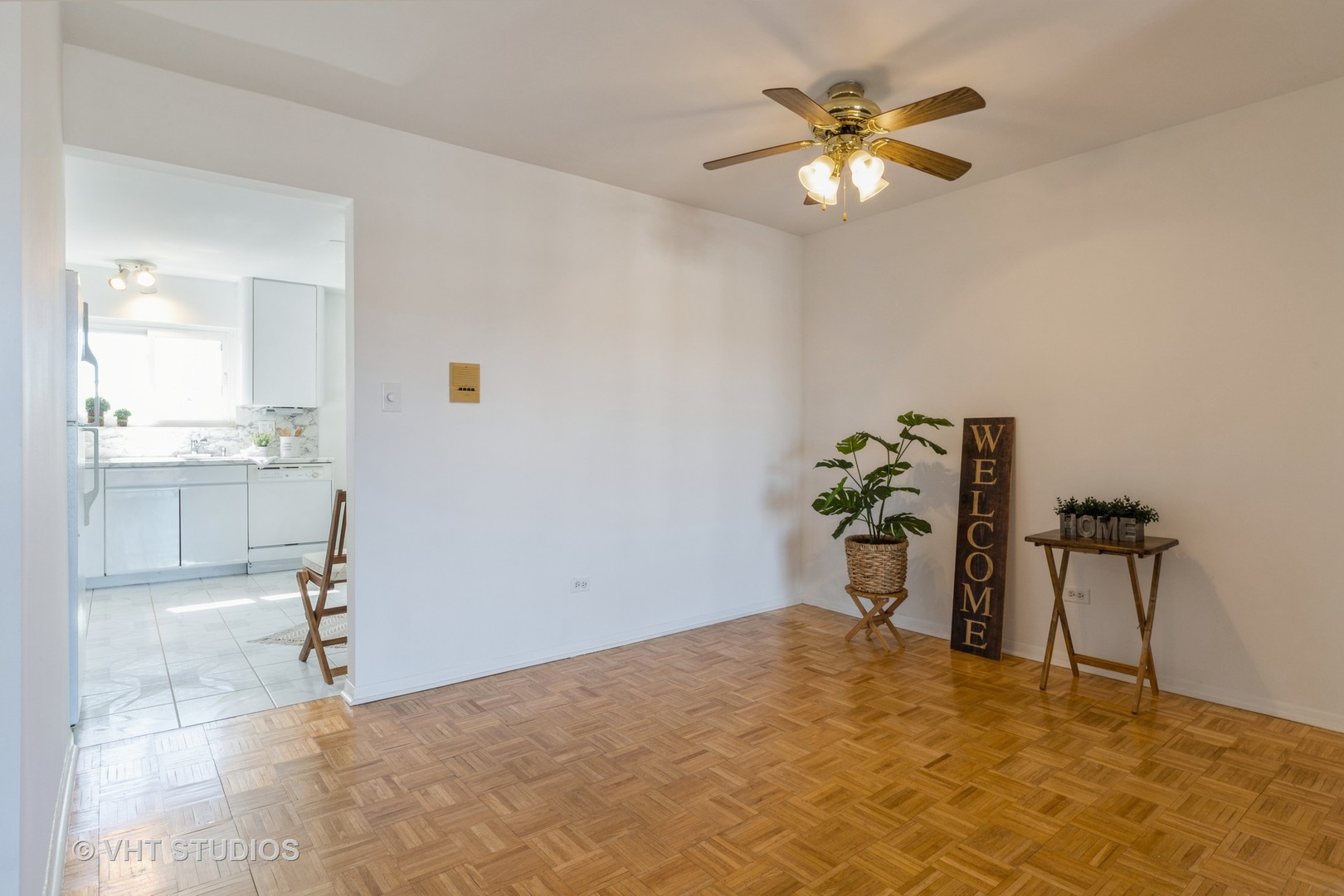 2205 West Nichols Road, Unit F Arlington Heights, IL 60004 - Photo 8 of 15 a view of a livingroom with a workspace