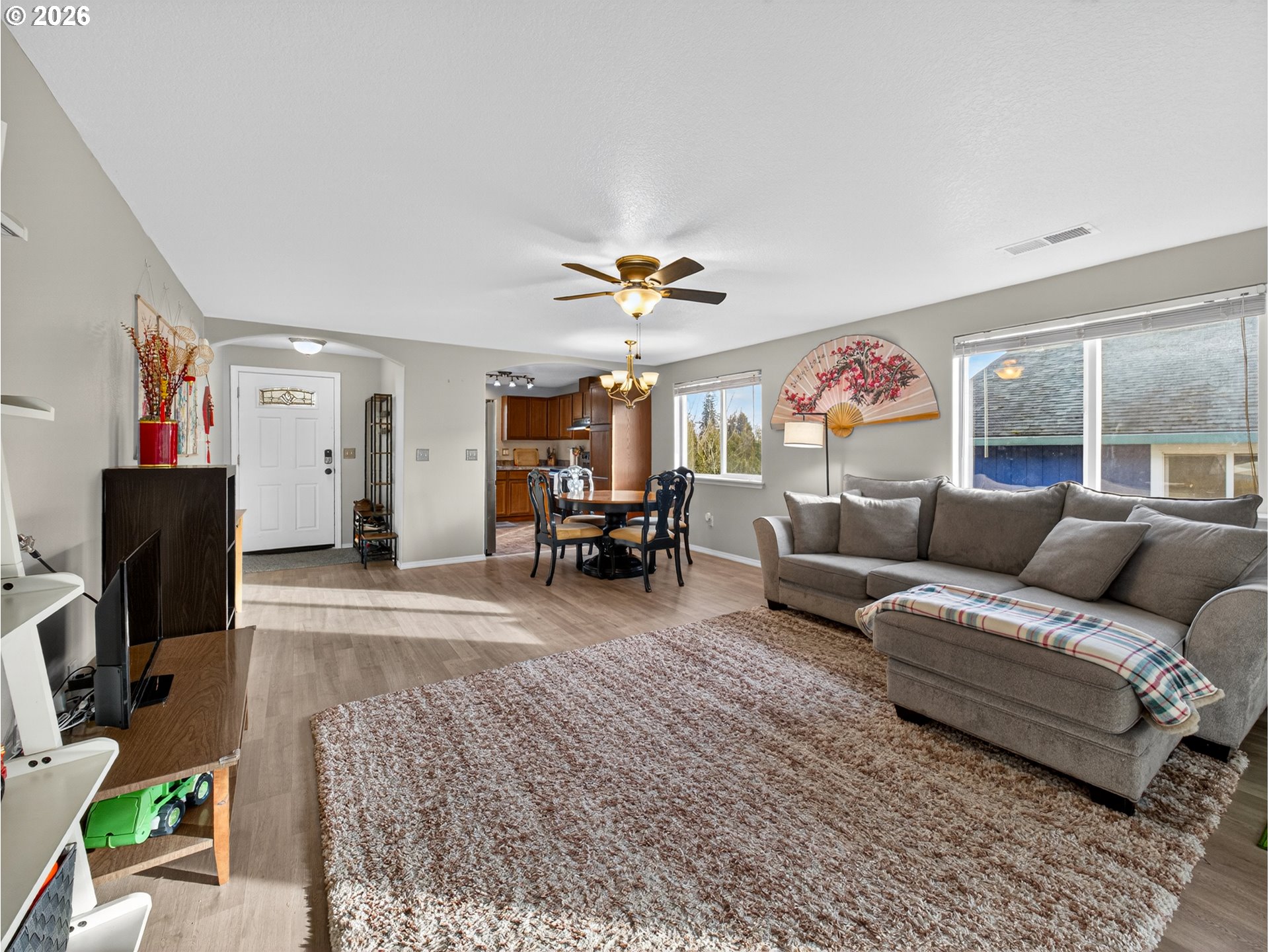 847 Northeast Duniway Road Lafayette, OR 97127 - Photo 13 of 38 a living room with furniture and a flat screen tv