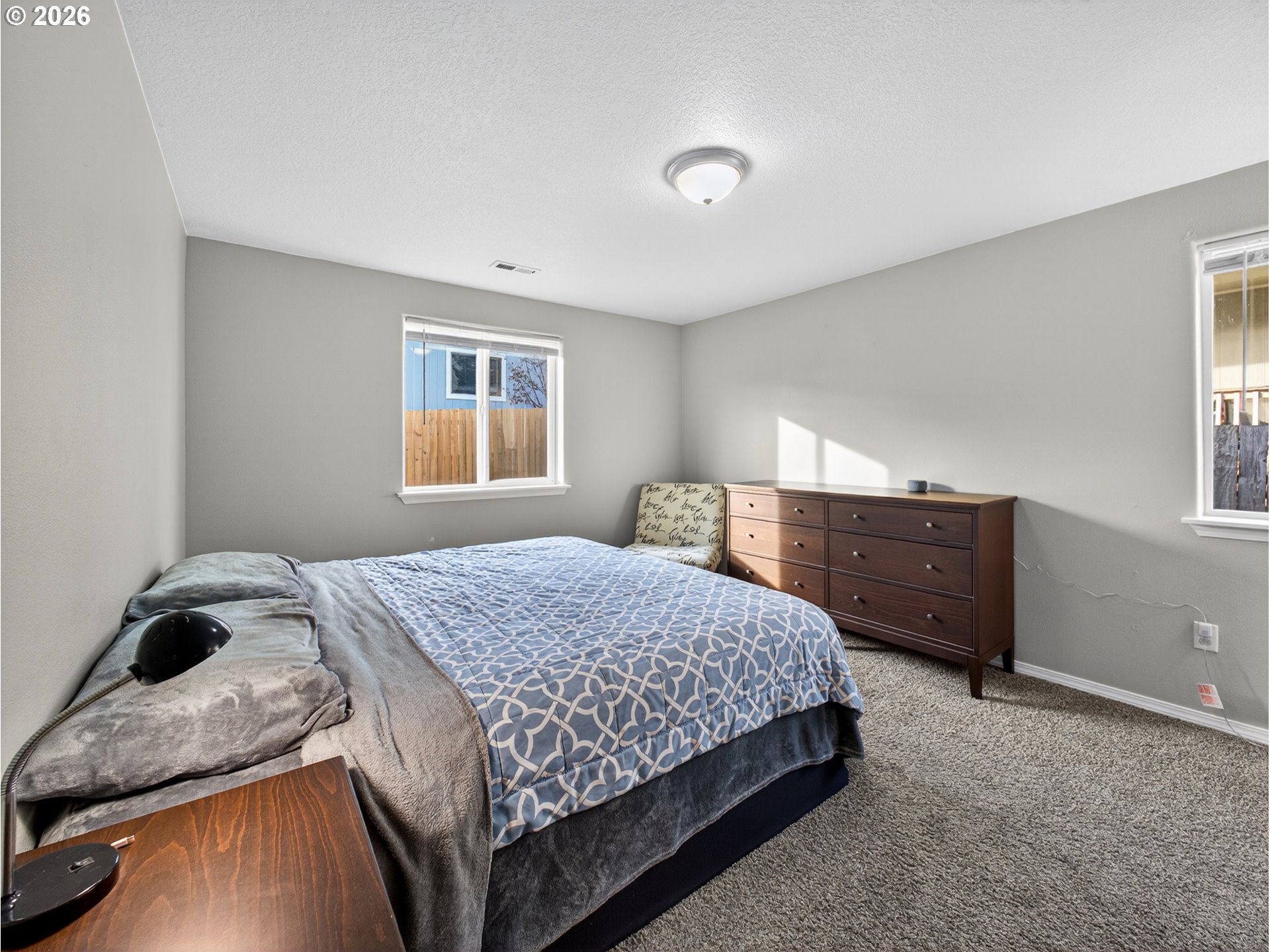 847 Northeast Duniway Road Lafayette, OR 97127 - Photo 14 of 38 a bedroom with a bed and a window