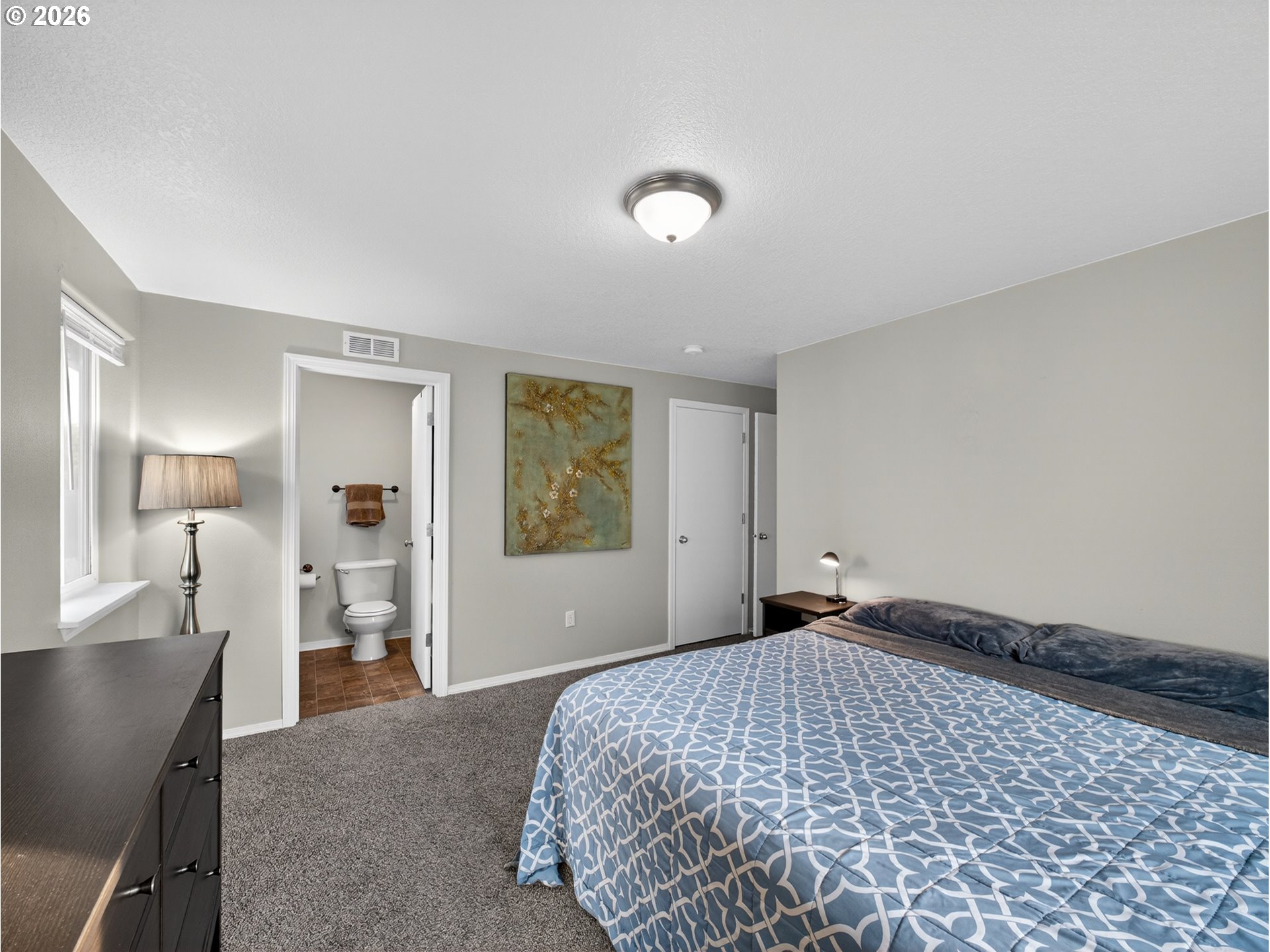 847 Northeast Duniway Road Lafayette, OR 97127 - Photo 15 of 38 a bedroom with a bed and window