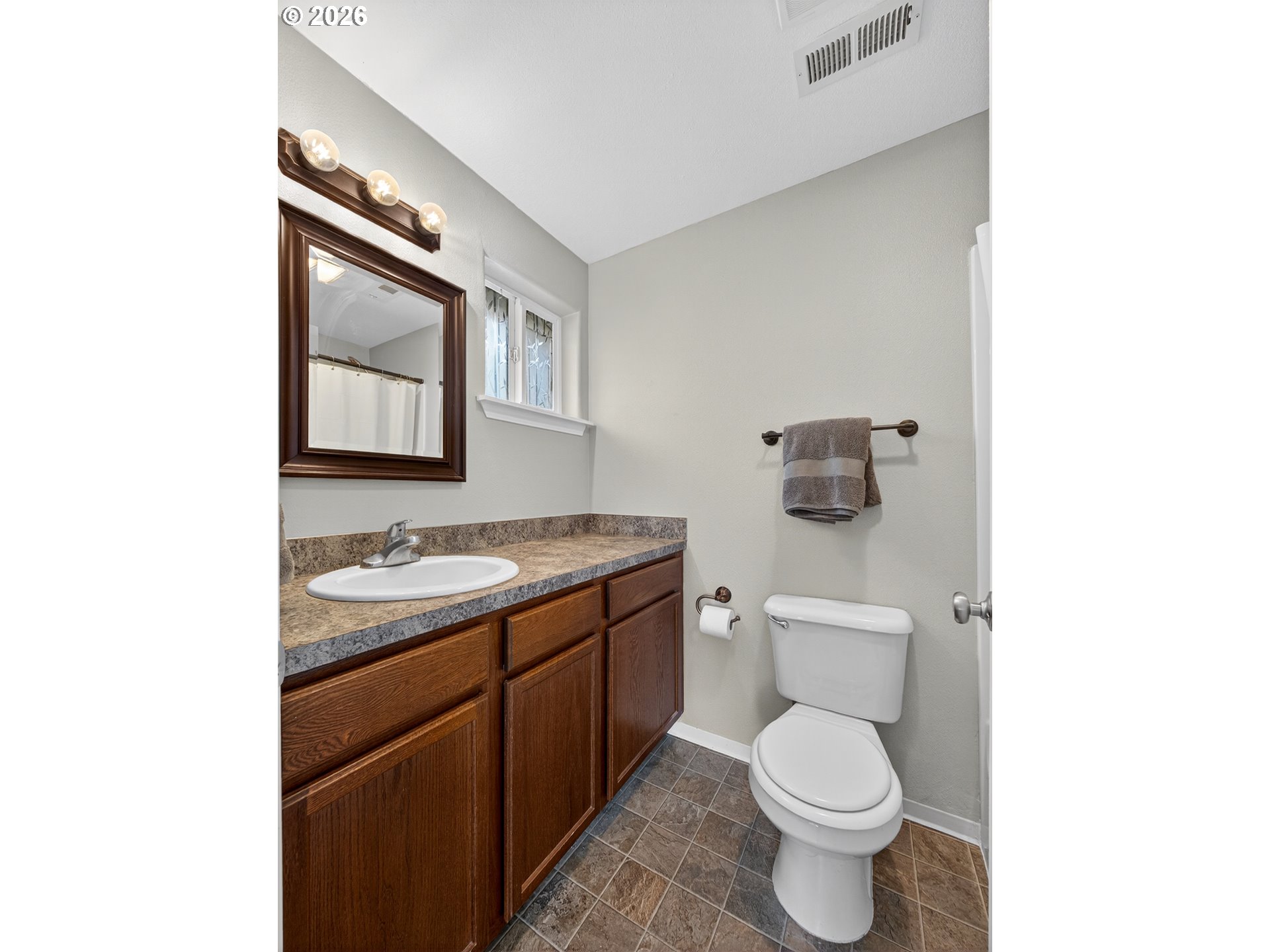 847 Northeast Duniway Road Lafayette, OR 97127 - Photo 16 of 38 a bathroom with a toilet a sink and mirror