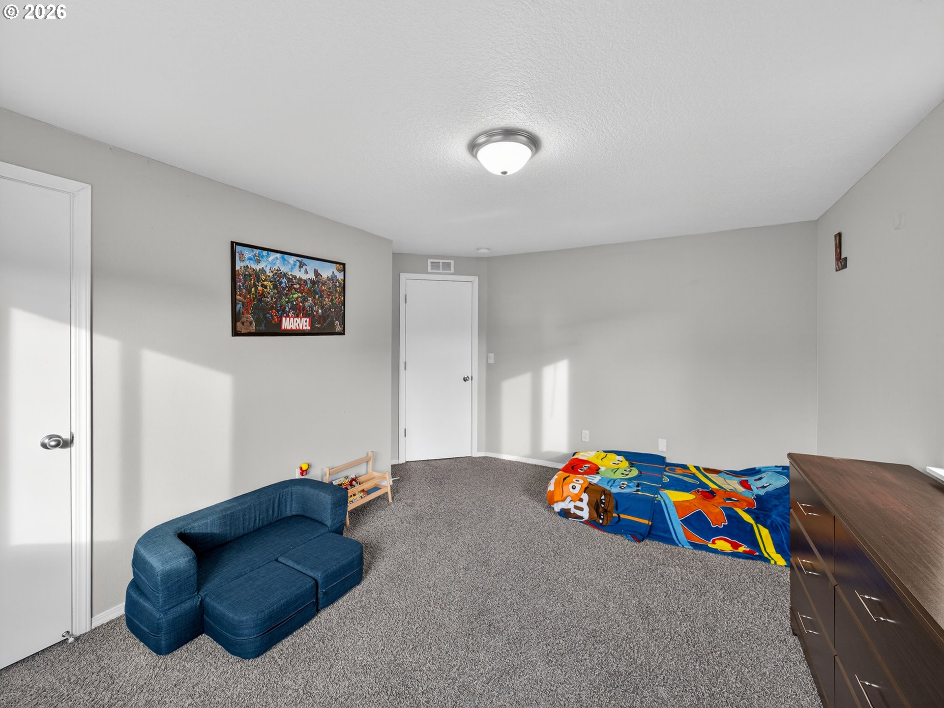 847 Northeast Duniway Road Lafayette, OR 97127 - Photo 19 of 38 a bedroom with a bed and a couch