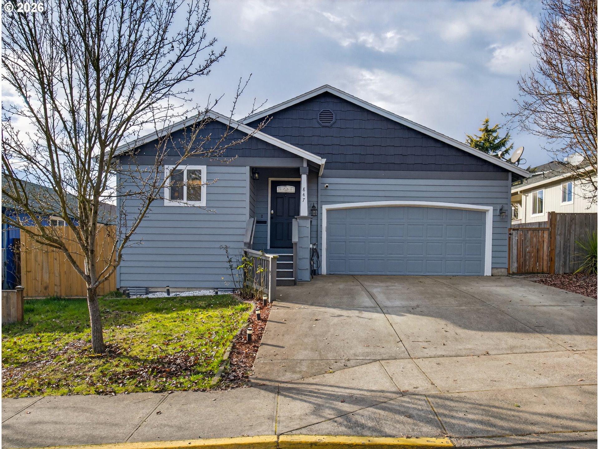 847 Northeast Duniway Road Lafayette, OR 97127 - Photo 2 of 38 a front view of house with garage and yard