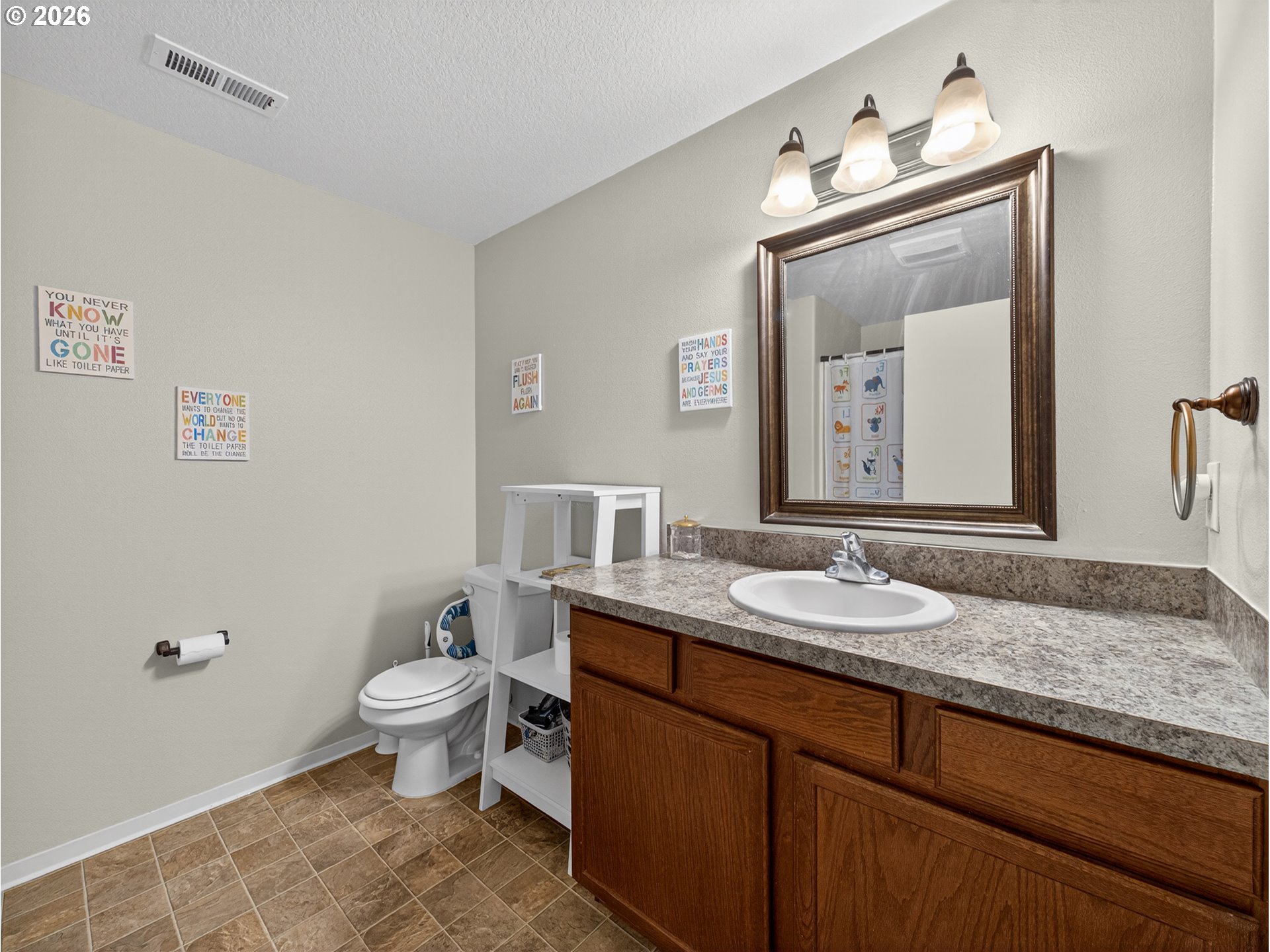 847 Northeast Duniway Road Lafayette, OR 97127 - Photo 21 of 38 a bathroom with a granite countertop toilet a sink and mirror