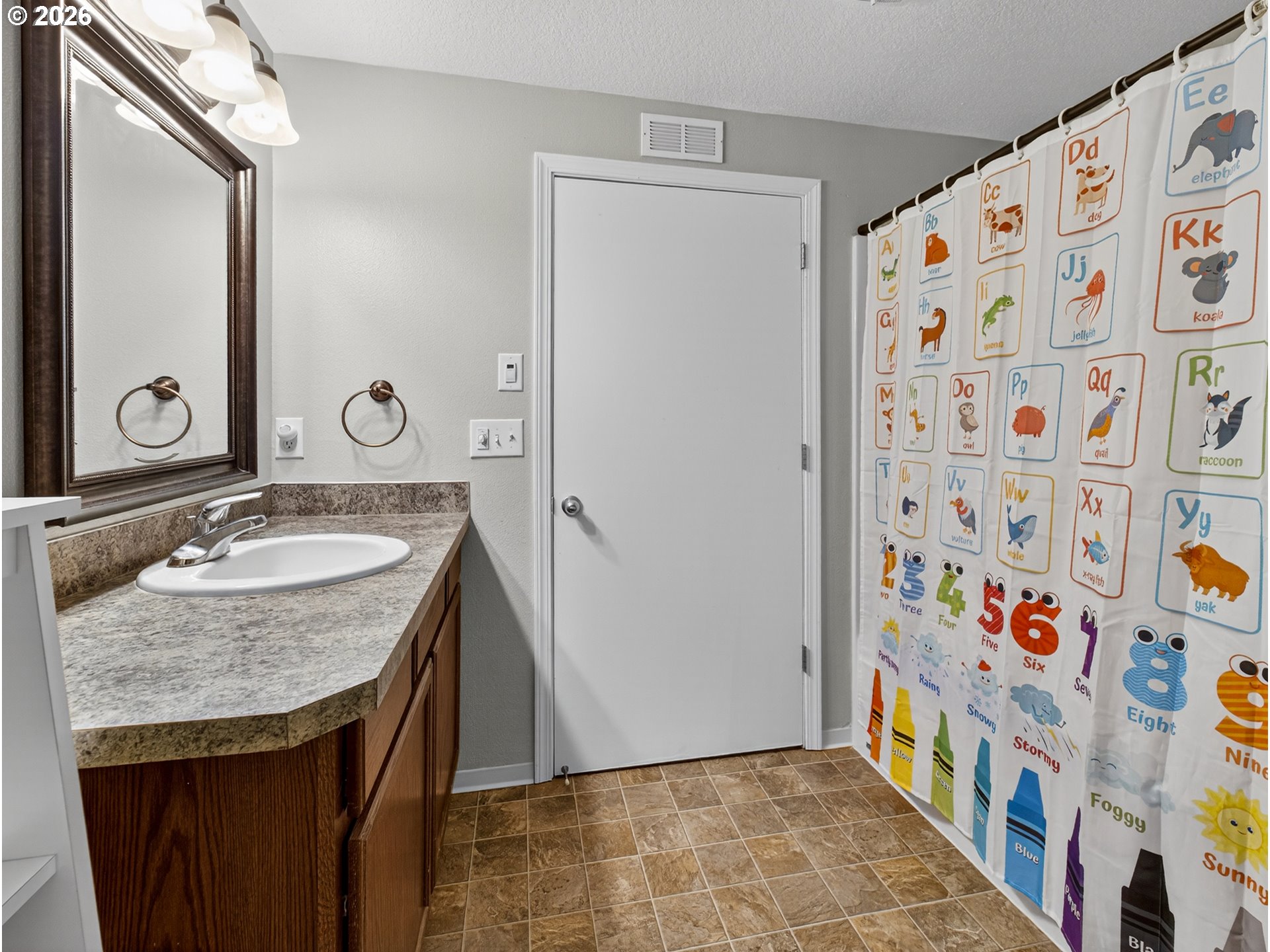 847 Northeast Duniway Road Lafayette, OR 97127 - Photo 22 of 38 a bathroom with a sink and a mirror