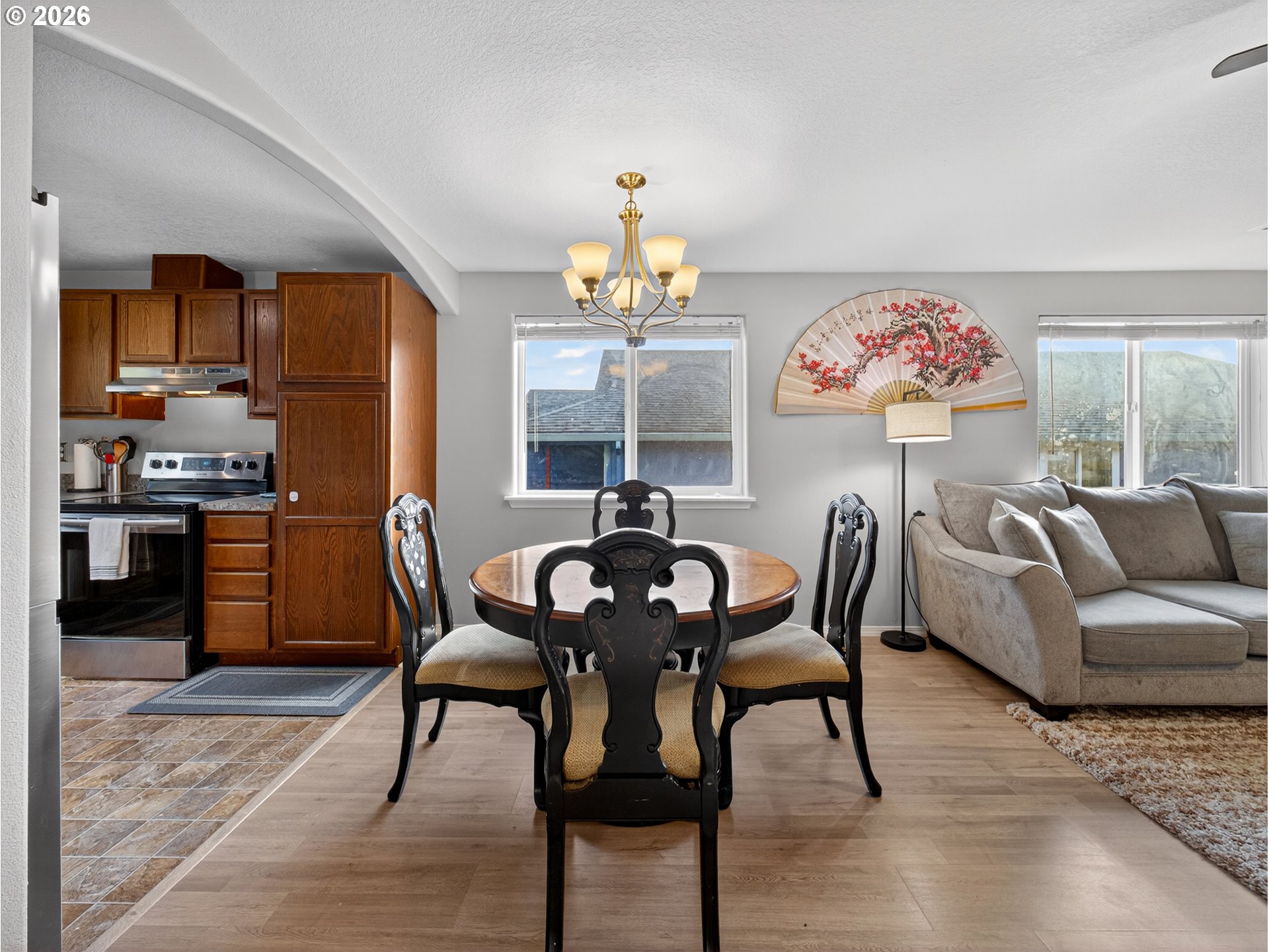 847 Northeast Duniway Road Lafayette, OR 97127 - Photo 8 of 38 a view of a dining room with furniture a chandelier and wooden floor