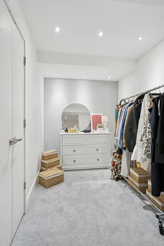 a view of room with stairs and closet