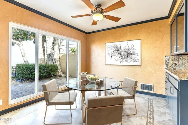 a dining room with furniture and window