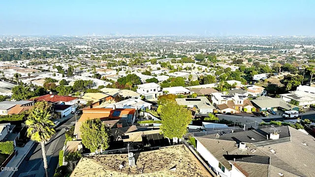 an aerial view of a city with lots of residential buildings