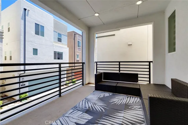 a view of a livingroom with furniture and staircase