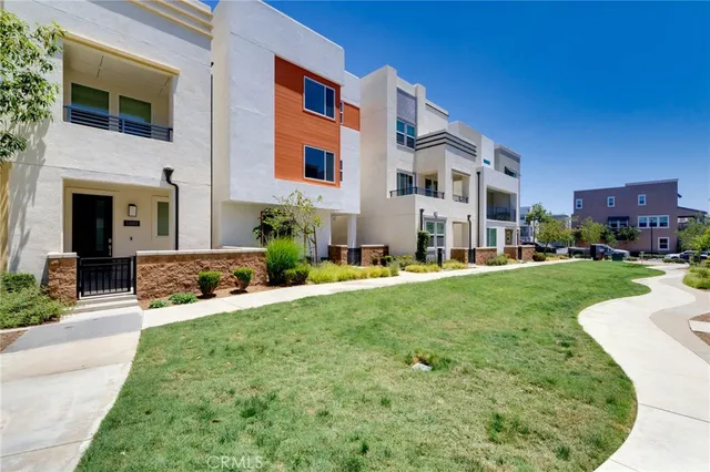 a view of a house with a yard porch and sitting area