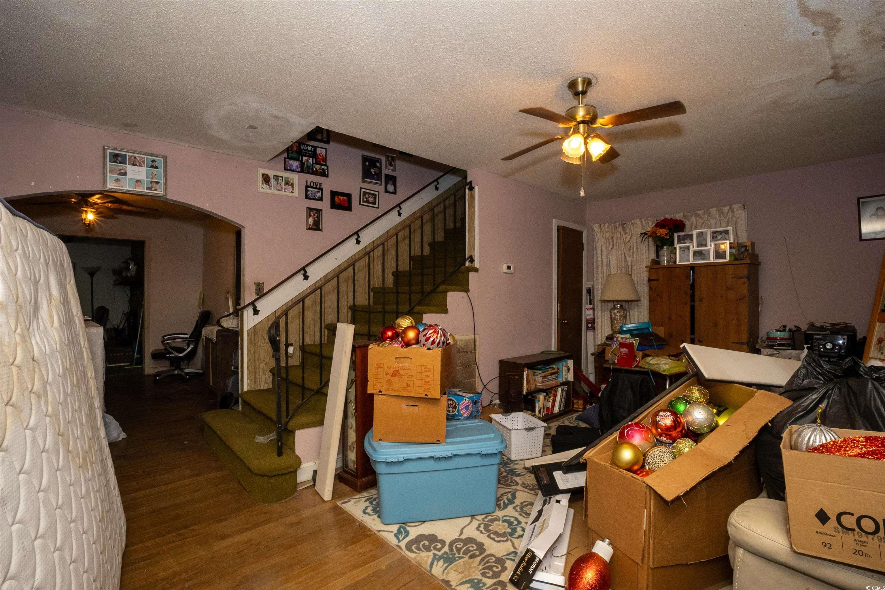 2405 South Island Road Georgetown, SC 29440 - Photo 2 of 24 Living room with wood finished floors, a textured ceiling, stairway, and ceiling fan