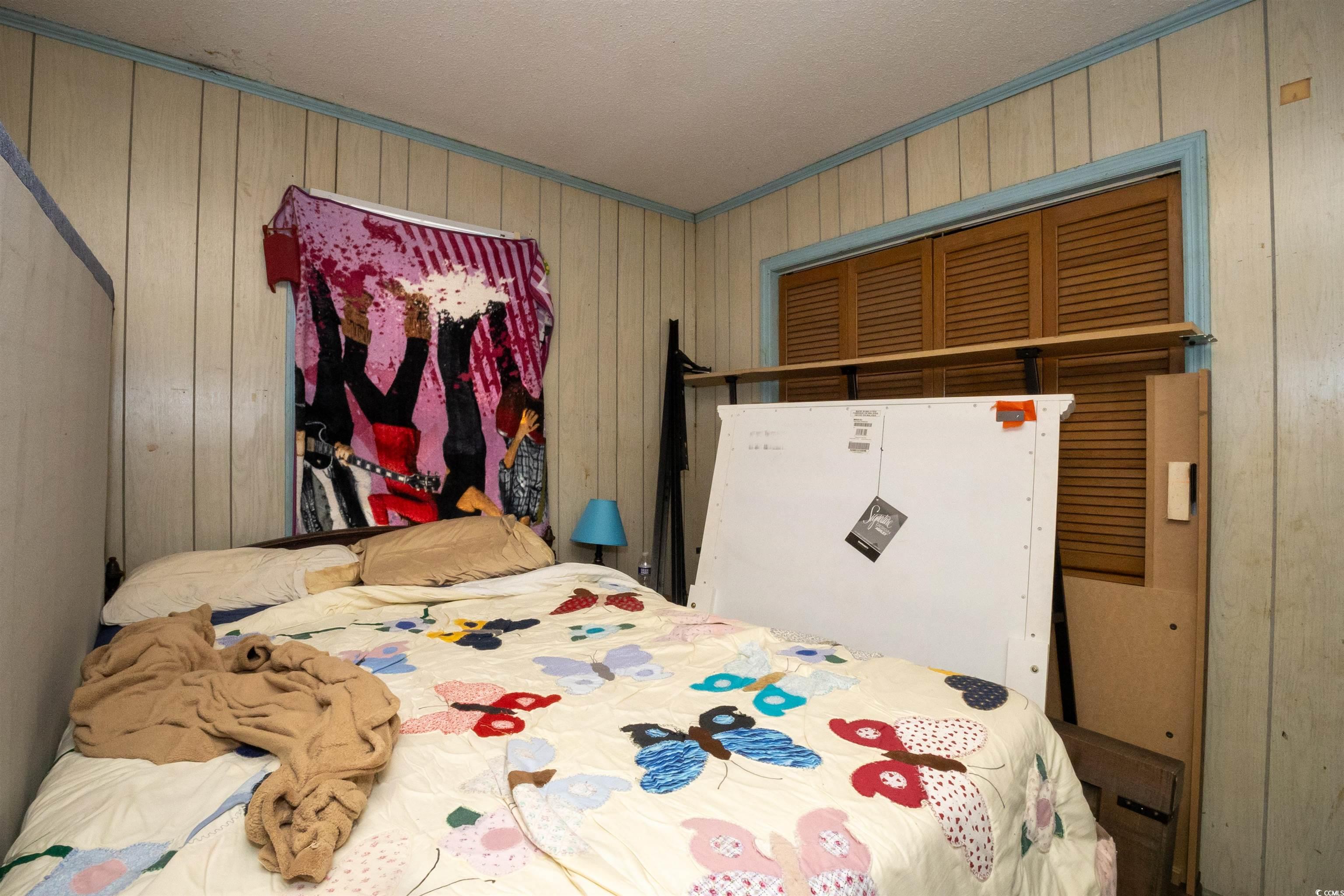 2405 South Island Road Georgetown, SC 29440 - Photo 10 of 24 Bedroom featuring wooden walls