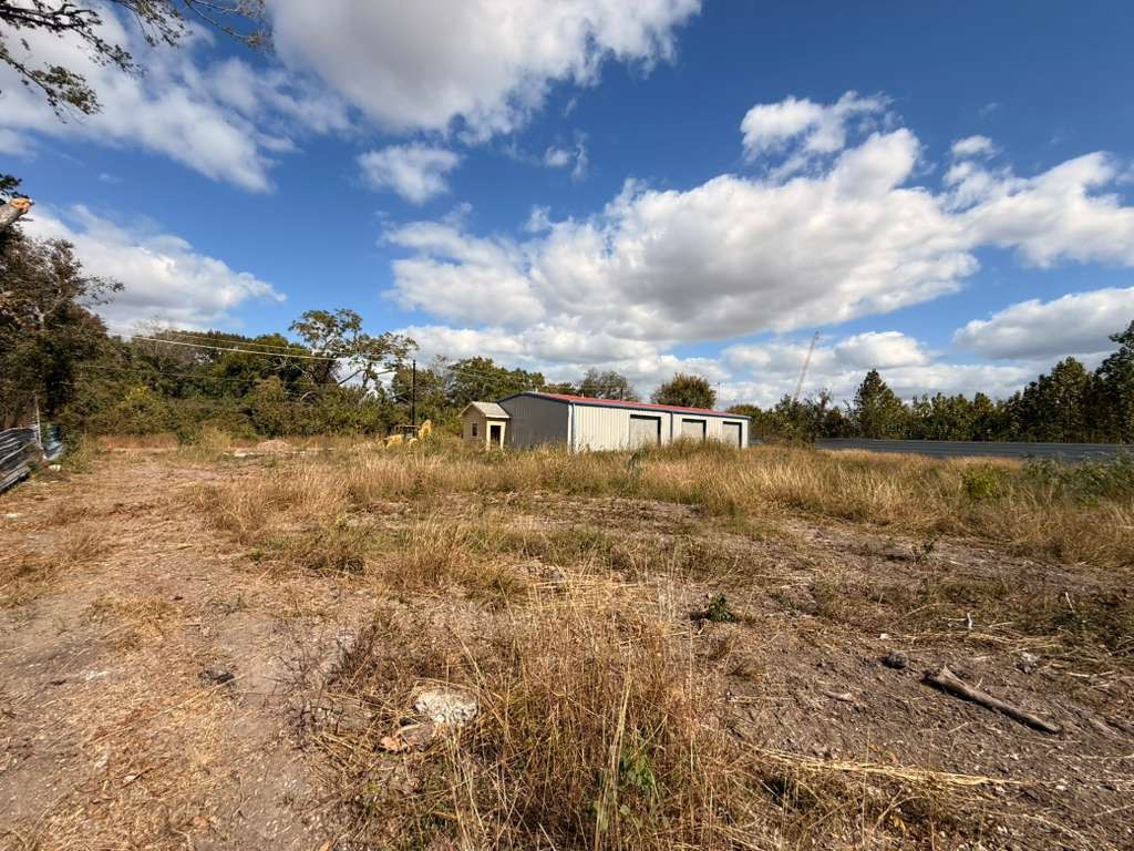 13018 Swingle Road Houston, TX 77047 - Photo 12 of 13 a view of a lake with houses in the back