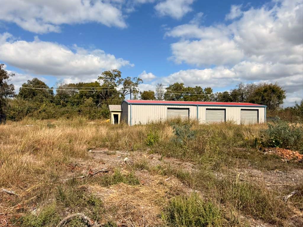 13018 Swingle Road Houston, TX 77047 - Photo 10 of 13 a view of a lake with a building in the background