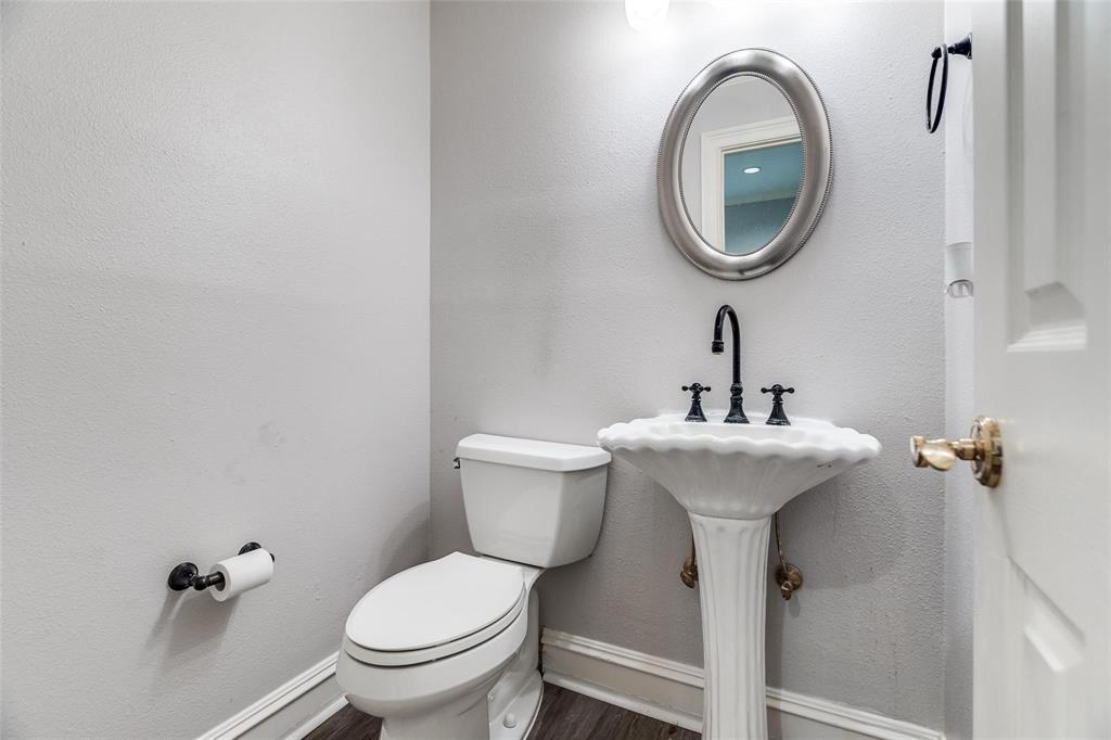5325 Bent Tree Forest Drive, Unit 2244 Dallas, TX 75248 - Photo 11 of 15 a bathroom with a toilet and a sink