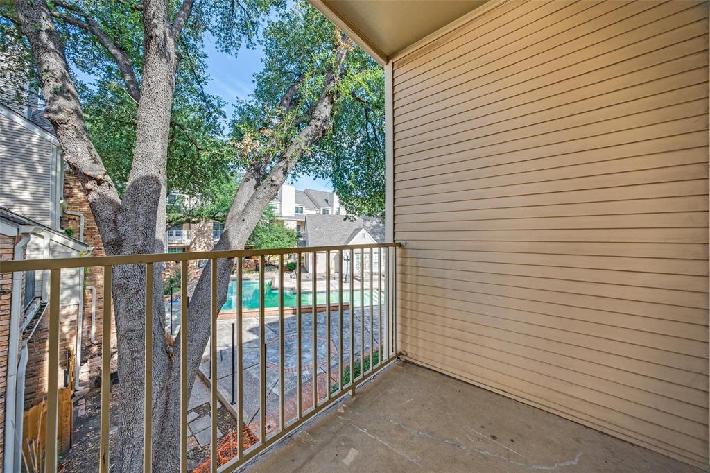 5325 Bent Tree Forest Drive, Unit 2244 Dallas, TX 75248 - Photo 13 of 15 a view of a balcony with trees
