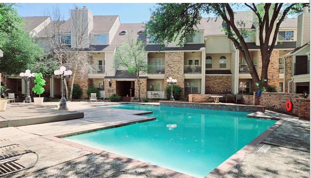 5325 Bent Tree Forest Drive, Unit 2244 Dallas, TX 75248 - Photo 15 of 15 a view of a house with a swimming pool and a yard