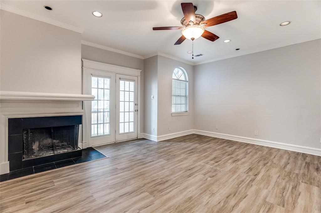5325 Bent Tree Forest Drive, Unit 2244 Dallas, TX 75248 - Photo 4 of 15 a view of an empty room with window and fireplace