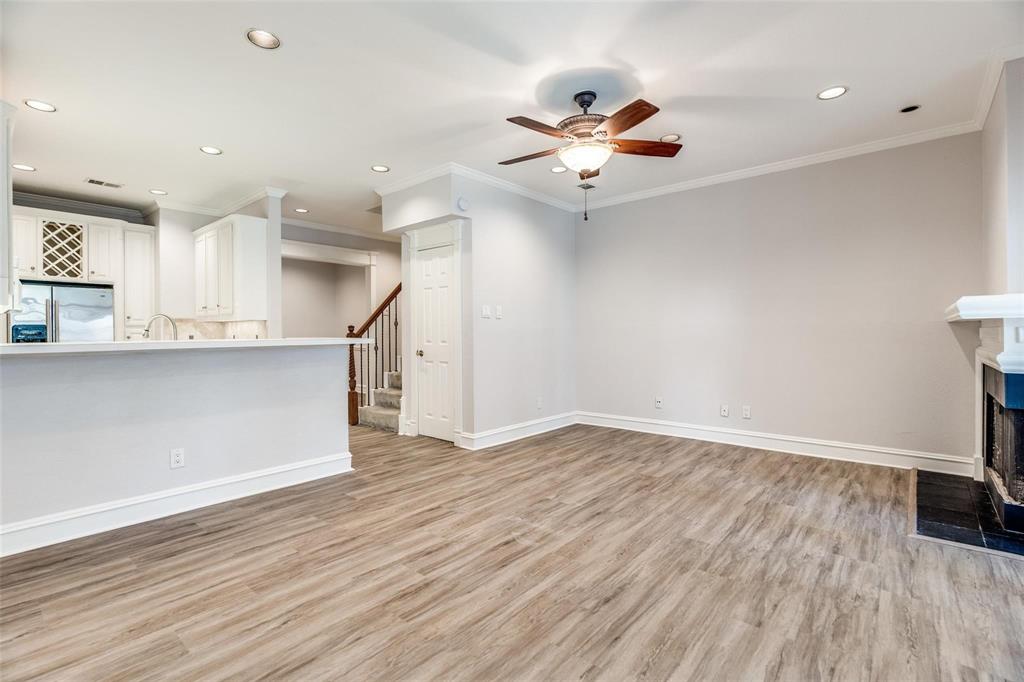 5325 Bent Tree Forest Drive, Unit 2244 Dallas, TX 75248 - Photo 5 of 15 wooden floor in an empty room with a window