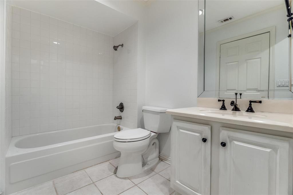 5325 Bent Tree Forest Drive, Unit 2244 Dallas, TX 75248 - Photo 9 of 15 a bathroom with a sink a toilet and shower