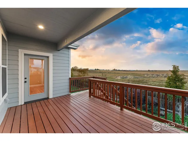 a view of balcony with wooden floor