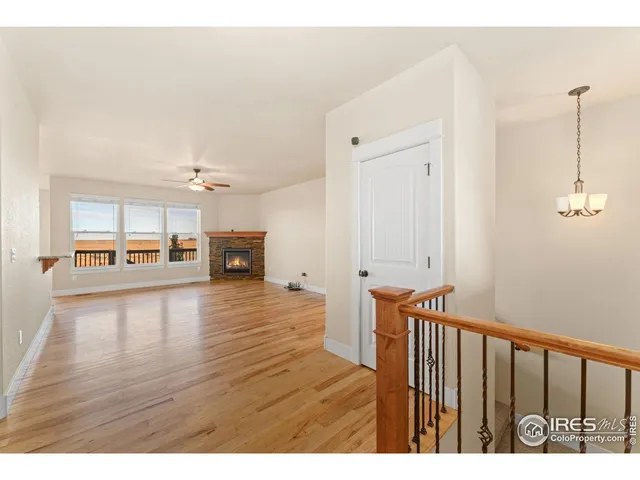 a view interior of a house wooden floor an entryway and fire place
