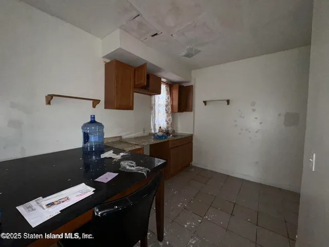 a reading room with furniture and wooden floor