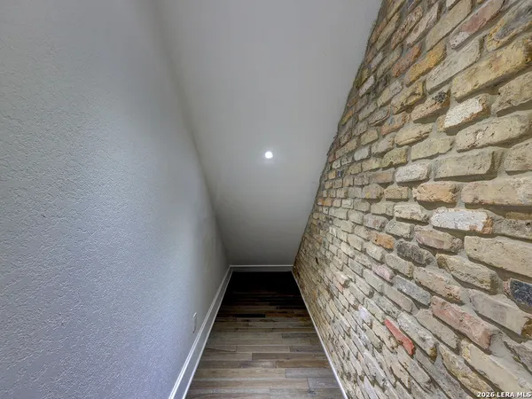 a spacious bathroom with a double vanity sink a mirror and a bathtub