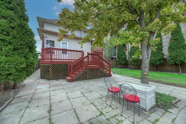 a view of a yard with furniture and a fire pit