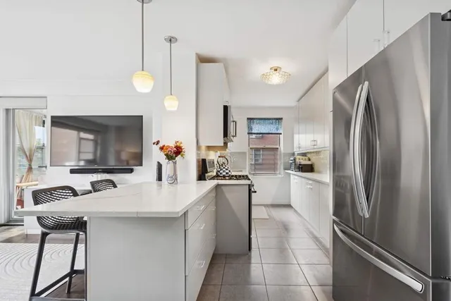 a bedroom with furniture and a fireplace