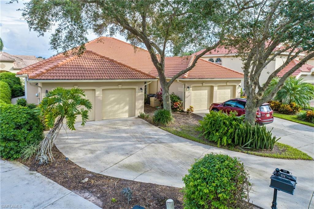 200 Napa Ridge Road East Naples, FL 34119 - Photo 1 of 1 front view of a house with a yard