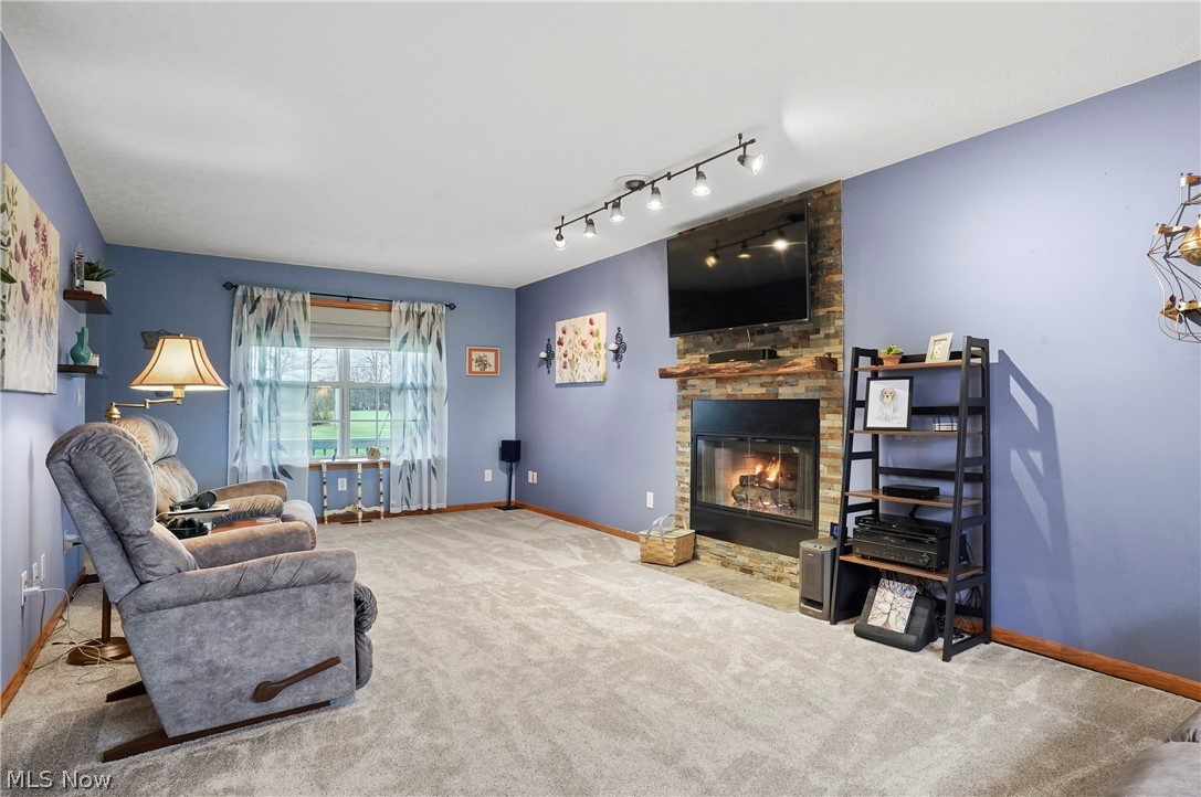 1825 New Milford Road Atwater, OH 44201 - Photo 9 of 34 Living room with fireplace and new carpet
