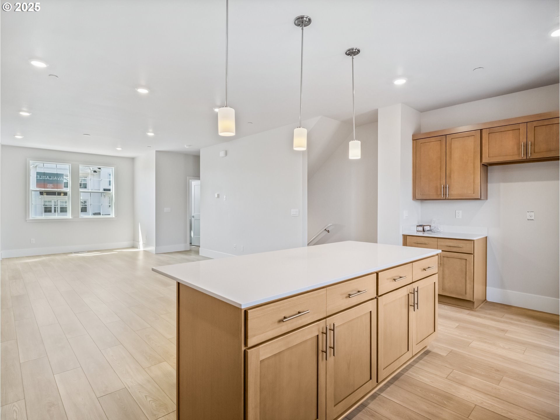 11950 Southwest 176th Drive Beaverton, OR 97007 - Photo 19 of 20 a kitchen that has a lot of white cabinets and wooden floor