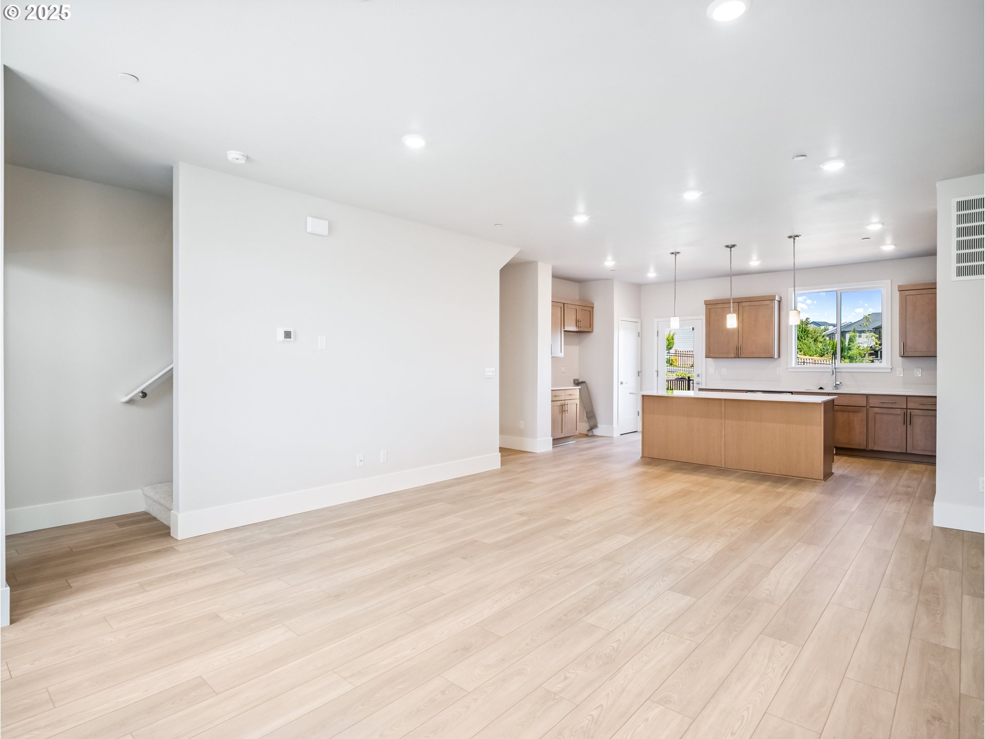 11950 Southwest 176th Drive Beaverton, OR 97007 - Photo 5 of 20 a view of a kitchen with a sink and a refrigerator