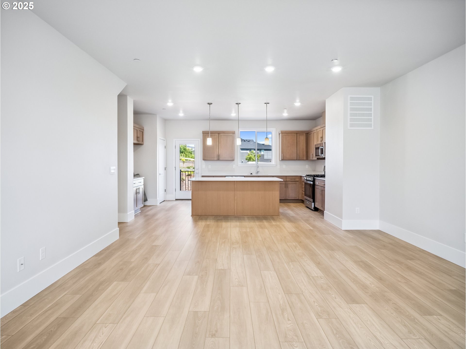 11950 Southwest 176th Drive Beaverton, OR 97007 - Photo 6 of 20 a view of a kitchen with a sink and a refrigerator