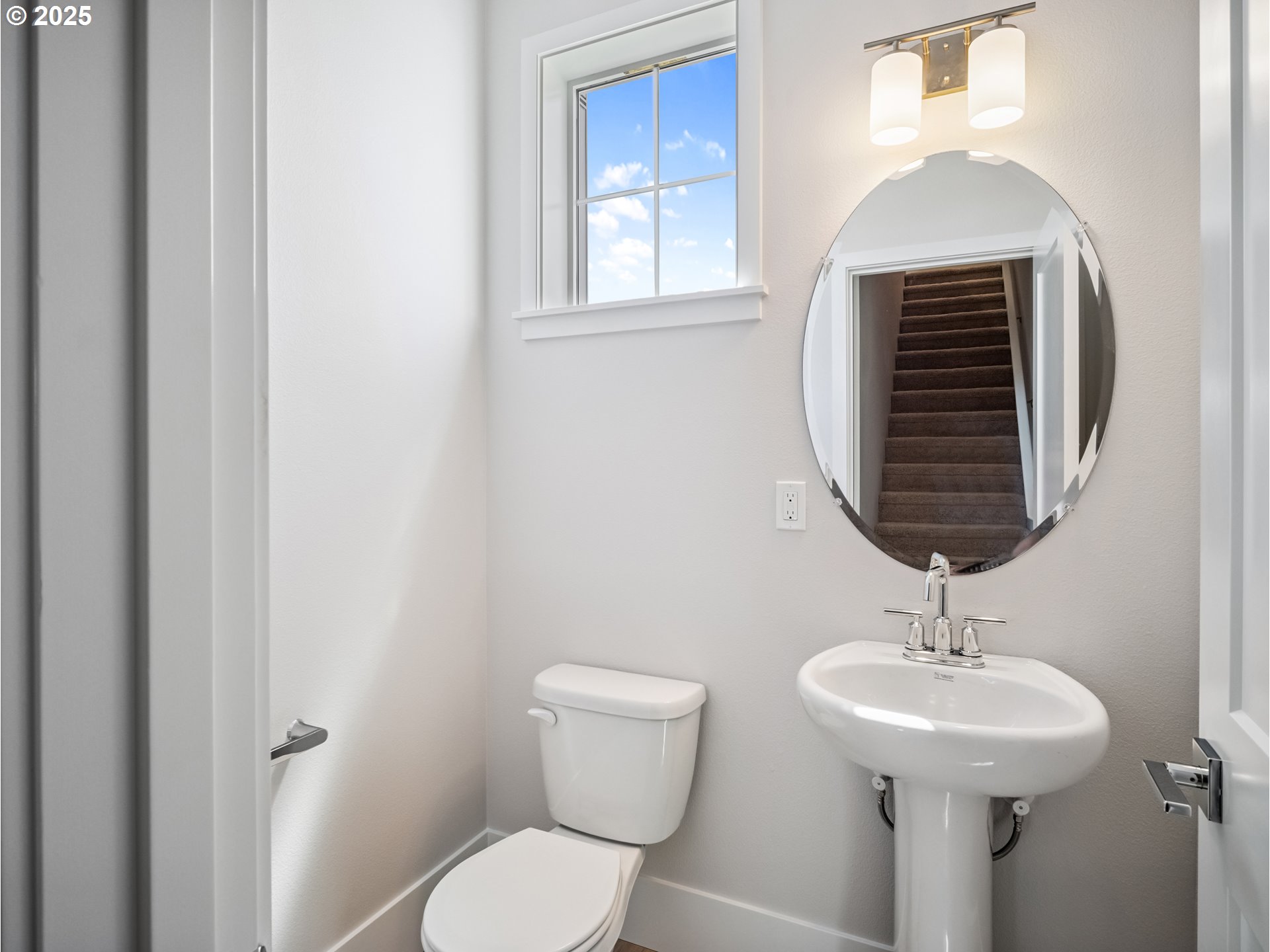 11950 Southwest 176th Drive Beaverton, OR 97007 - Photo 7 of 20 a bathroom with a toilet a sink and a mirror