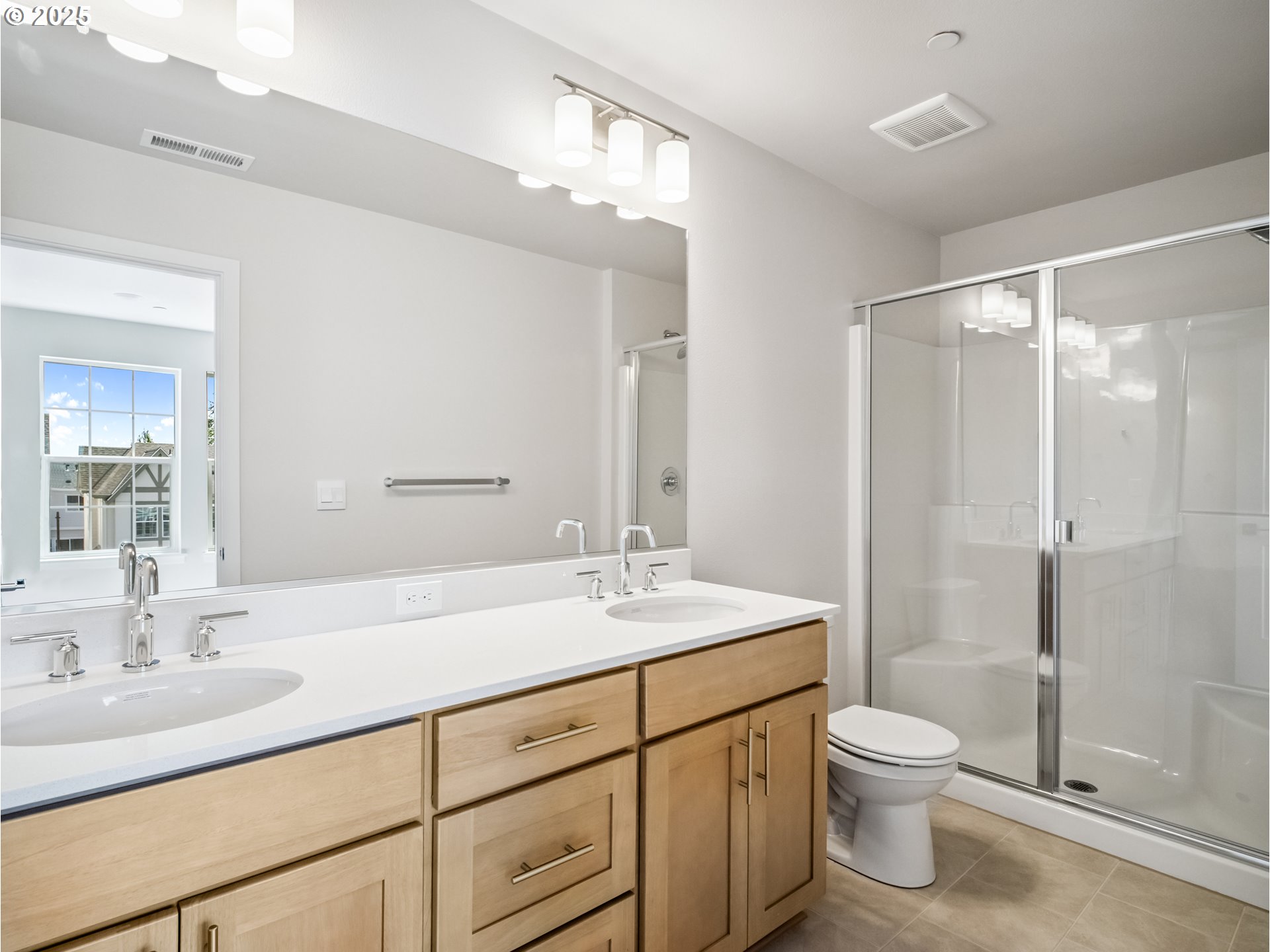 11950 Southwest 176th Drive Beaverton, OR 97007 - Photo 10 of 20 a bathroom with a sink toilet a mirror and shower