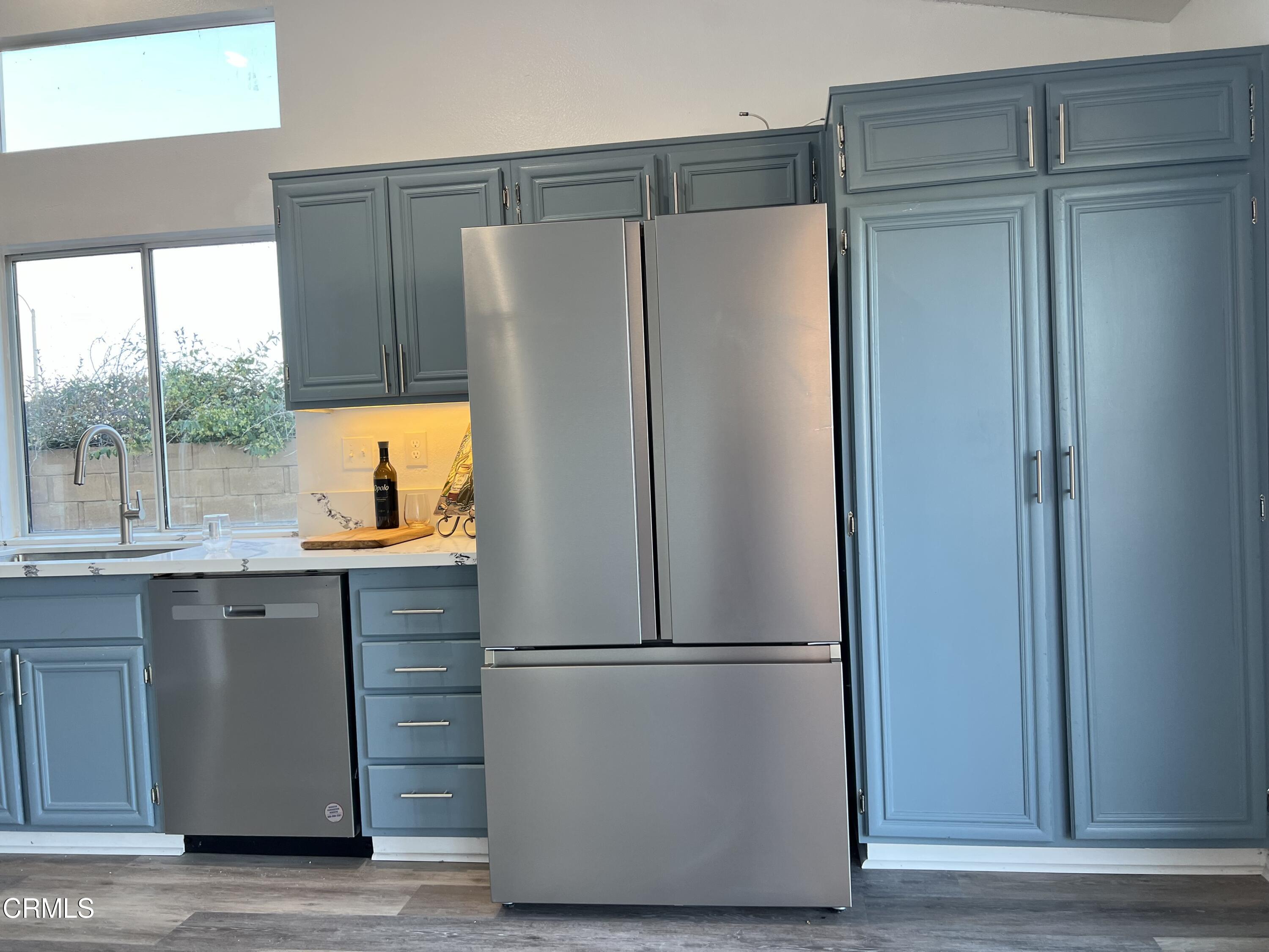 44762 Shadowcrest Drive Lancaster, CA 93536 - Photo 13 of 31 a view of a refrigerator in kitchen and a sink