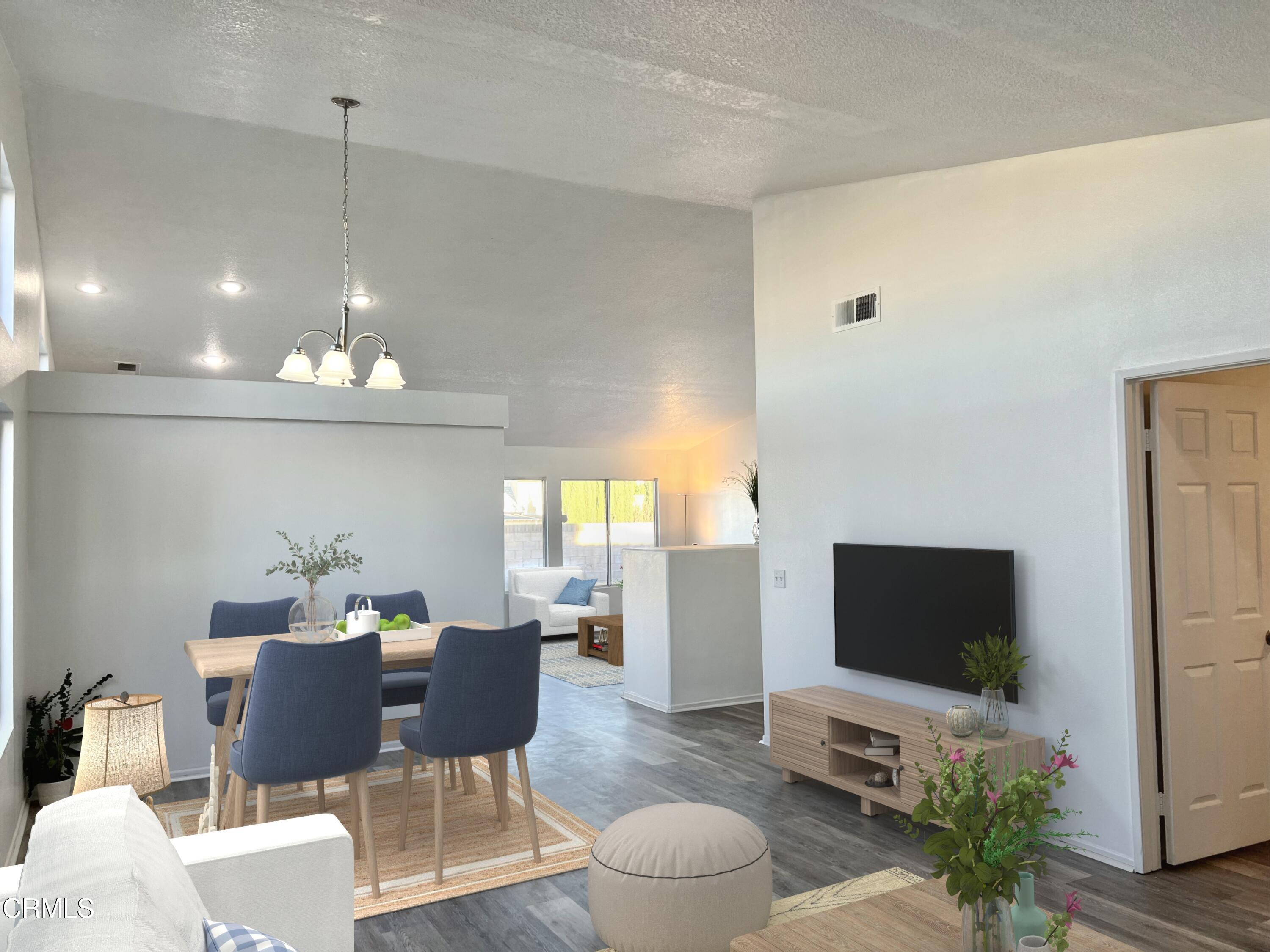 44762 Shadowcrest Drive Lancaster, CA 93536 - Photo 3 of 31 a view of a livingroom with furniture and a flat screen tv
