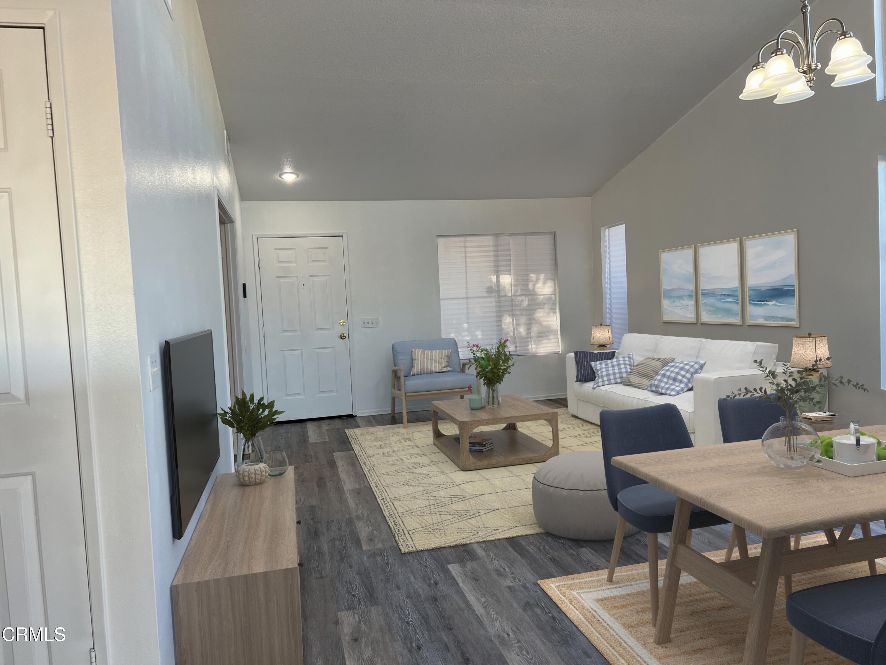 44762 Shadowcrest Drive Lancaster, CA 93536 - Photo 5 of 31 a living room with furniture and a chandelier