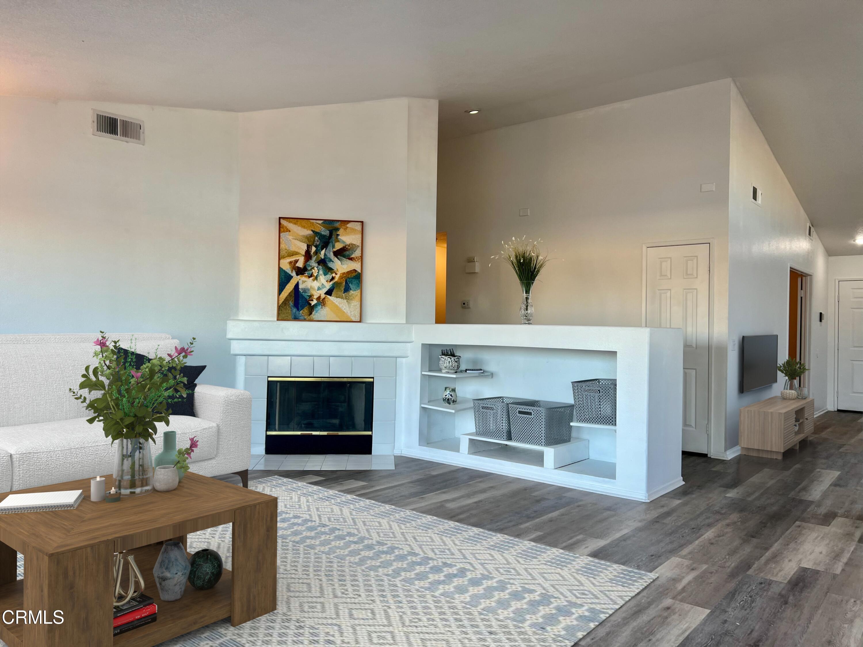 44762 Shadowcrest Drive Lancaster, CA 93536 - Photo 8 of 31 a living room with furniture and a fireplace